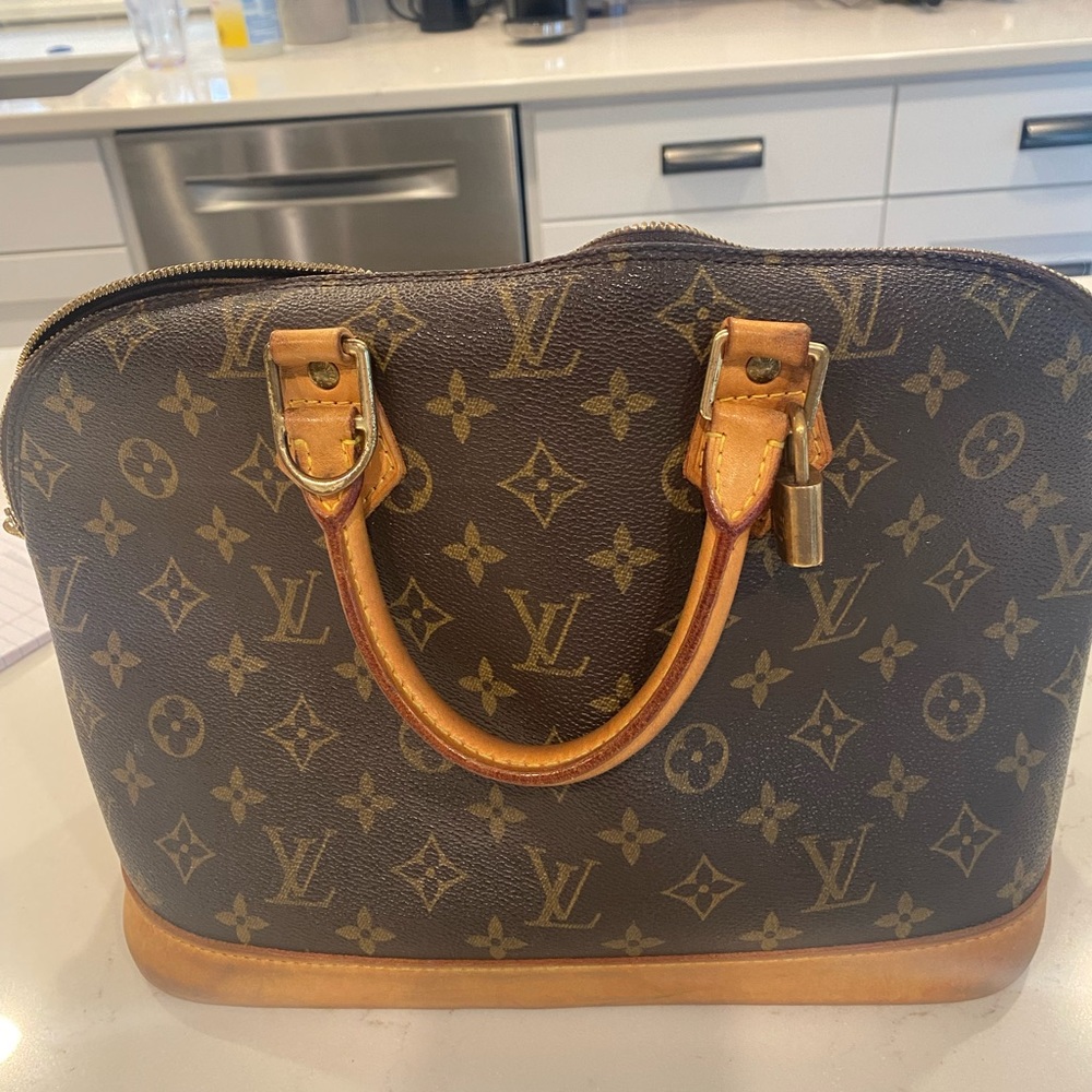 Louis Vuitton Alma Handbag - used